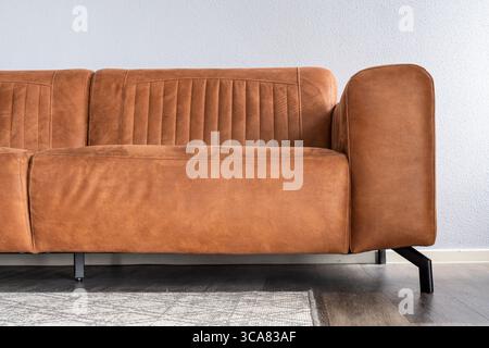 brown leather sofa in apartment Stock Photo