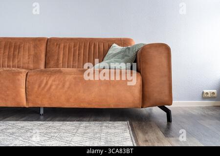 brown leather sofa in apartment Stock Photo
