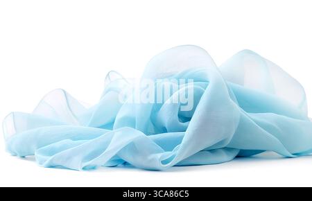 Transparent light blue fabric draped in waves on white background Stock Photo