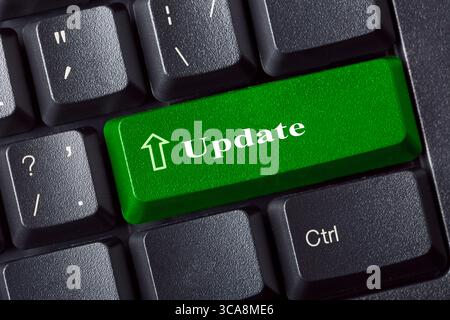 Conceptual keyboard with Update green key label inscription. IT Security concept. Close up view Stock Photo
