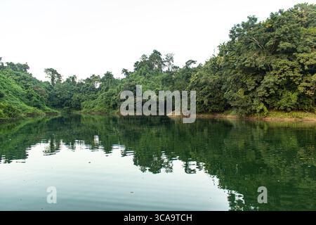 Serene Kaptai Lake beside the lush green hills in Bangladesh Stock Photo