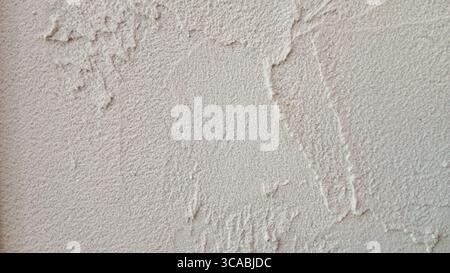 Close-Up of Rough Textured Plastered Wall in Neutral Beige Tone Stock Photo