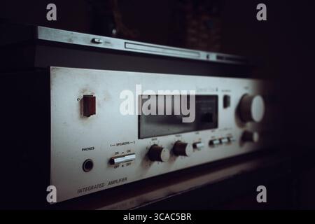 Old home hi-fi amplifier and receiver with cd player on top. Stock Photo