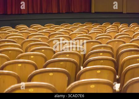 Brown vintage seats armchairs in theater. Theater or conference room interior Stock Photo