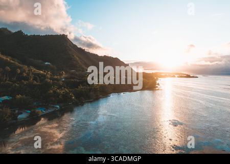 Sunset light over the turquoise lagoon and coastline of Moorea Island, Tahiti. Stock Photo