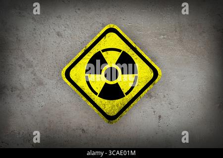 Radioactive sign on grey textured surface. Radiological pollution Stock Photo