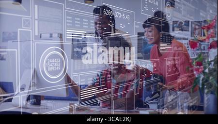 Collaborating team analyzing data visuals at office desk, with monitor, stylus and chart overlays Stock Photo