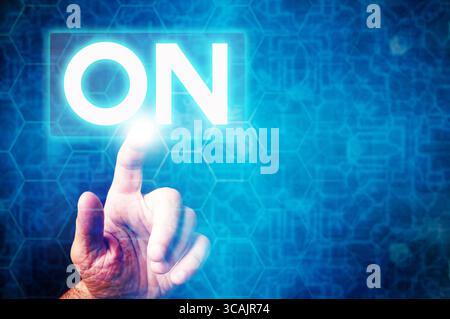 Activating technology with a touch, futuristic interface with ON button glowing Stock Photo