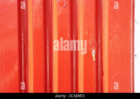 red painted and peeling corrugated iron Stock Photo