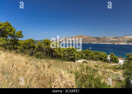 Panoramic view of the island of Ciovo, Trogir, Dalmatia, from a high vantage point, lush green Mediterranean vegetation on the island Stock Photo