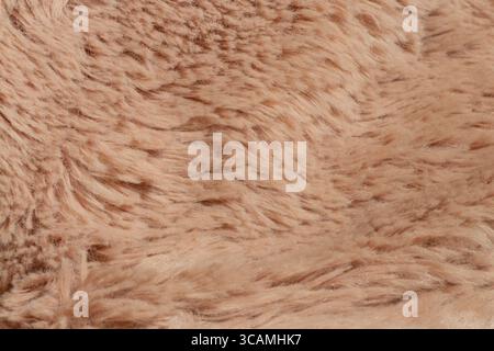 Light brown faux fur close up - fabric texture for clothes, blanket, pillow, interior Stock Photo