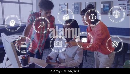 Collaborating three coworkers analyzing data on computer in office workspace, with interface icons Stock Photo