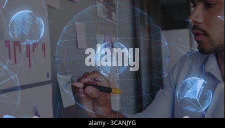 Organizing engineer writing sticky notes at office, with pen holographic network globes, copy space Stock Photo