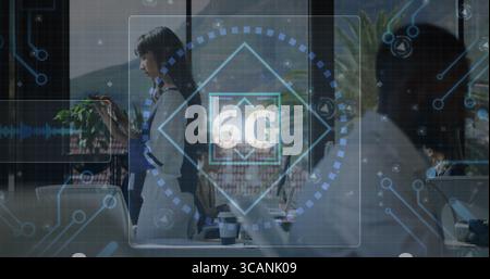 Projecting transparent 6G holographic interface in open-plan office, featuring smartphone, laptops Stock Photo