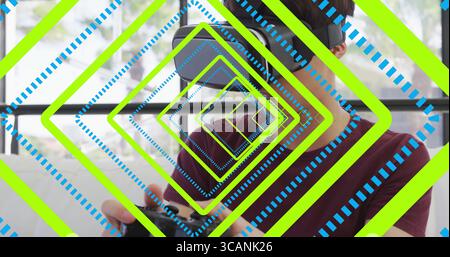 Using game controller, teen boy wearing VR headset on home couch by glass window, copy space Stock Photo