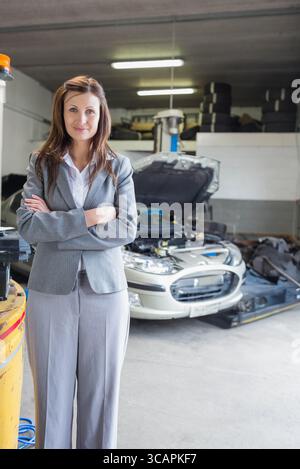 Modern car lifted on a hydraulic platform in an auto repair shop ...