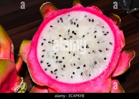 Fresh Dragon ( Pitaya ) fruit on  wooden table Stock Photo