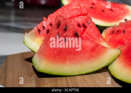 Fresh ripe sliced watermelon on white plate. Healthy food concept, season fruit, summer fruit. Fresh watermelon sliced. summertime Stock Photo