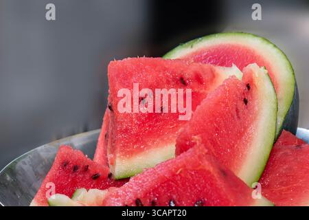 Fresh ripe sliced watermelon on white plate. Healthy food concept, season fruit, summer fruit. Fresh watermelon sliced. summertime Stock Photo