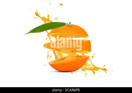 Ripe Orange slices and Orange juice is splashed isolated on white background Stock Photo