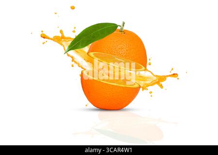 Ripe Orange slices and Orange juice is splashed isolated on white background Stock Photo