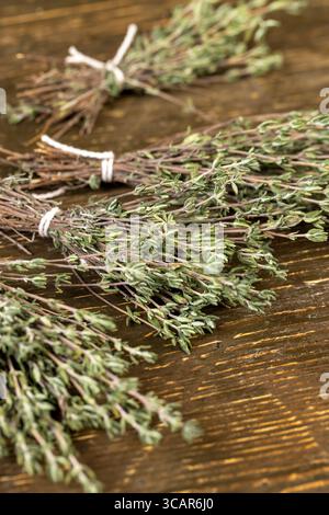 dry thyme tied together in bundles, aromatic spices of dried thyme for use in cooking and folk medicine Stock Photo