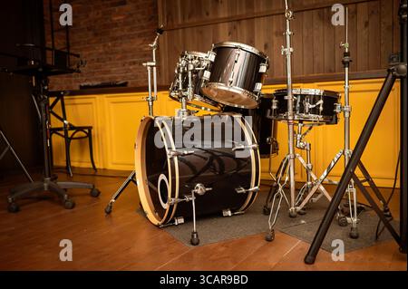 Drum set on stage in a recording studio. Musical instruments. Stock Photo