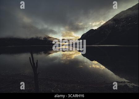 Sunrise with reflections in the Plansee in Tyrol in the Alps in Austria Stock Photo
