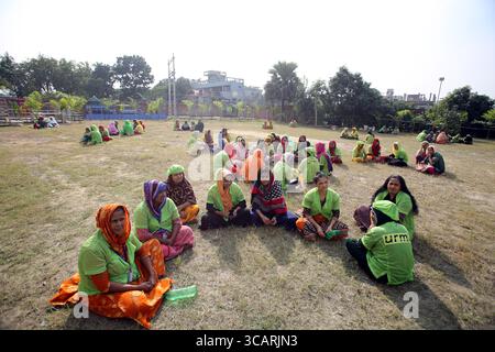 December 18, 2023, Dhaka, Wari, Bangladesh: Bangladeshi Garment workers taking rest in a ground during a break in Dhaka, Bangladesh on December 27, 2023. (Credit Image: © Habibur Rahman/ZUMA Press Wire) Stock Photo