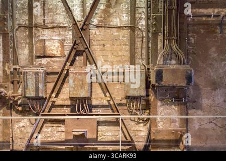 Weathered rusty industrial detail including old corroded electric control cabinets Stock Photo