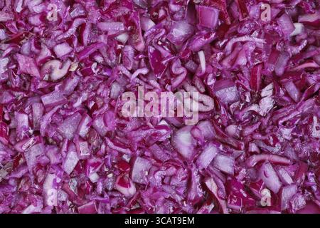Finely chopped red cabbage vegetable background. Studio macro shot Stock Photo