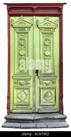 A very old archaic green wooden door with red frame. The paint crackled and the tree started to rot. Isolated on white with patch Stock Photo