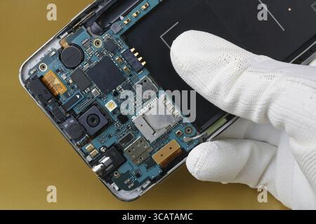Repair of printed circuit board for GSM smart phone Stock Photo