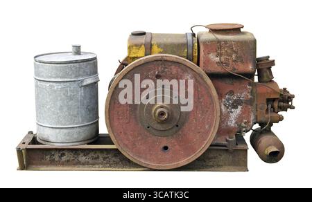 Rusty vintage small tractors diesel engine . The metal equipment is made more than hundred years ago. Mass production Stock Photo