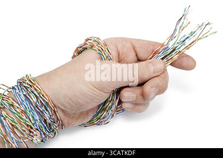Technician has prepared a computer internet twisted pair cable for connection. Isolated on white Stock Photo