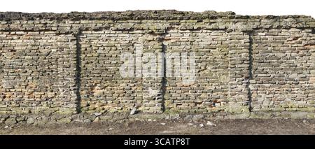Long fragment of the destroyed centenary monastery yellow brick wall and fence. Isolated on top panoramic collage from several photos Stock Photo