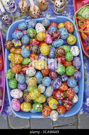 VILNIUS, LITHUANIA - MARCH 02, 2019: Traditional Lithuanian rural homemade wooden painted Easters eggs and gifts are sold on streets during the spring Stock Photo