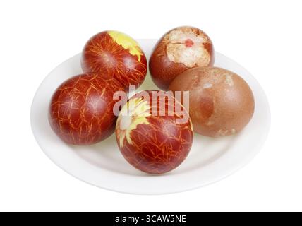 Easter chicken eggs painted in red rural colors with natural food dye - onion peel. Isolated on white studio macro Stock Photo