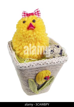 Easter handmade nest from rope with funny chicken and egg. Isolated on white studio macro shot Stock Photo