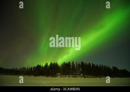 Northern lights and Milky Way, Lapland, Finland, Arctic Circle Stock Photo