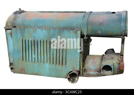 Rusty retro small tractors diesel engine painted blue. Isolated on white Stock Photo