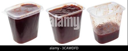 Transparent plastic storage containers of food are filled with plum jam. Set of fill in closed, opened and half empty boxes. Isolated on white Stock Photo