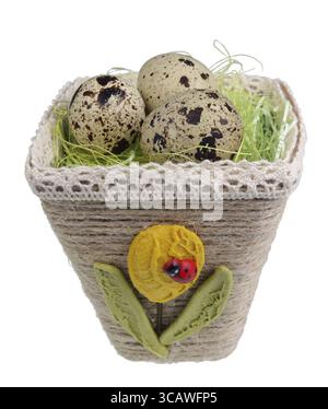 Easter handmade nest from rope with quail egg. Isolated on white studio macro shot Stock Photo