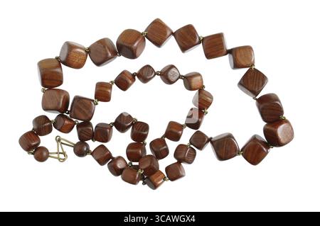 Homemade female beads are made of ebony and mahogany wooden simple cubes and balls. Isolated on white macro shot Stock Photo