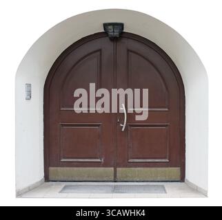 Wooden retro door with internal armored steel plates is hiddenin a deep arch niche. Isolated on white Stock Photo