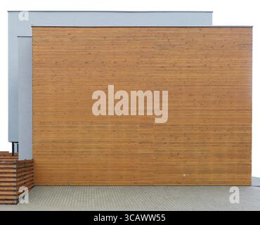 Modern new building wall made from horizontal wooden planks and gray concrete. Isolated on white Stock Photo