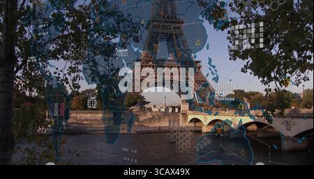 Framing branches showing Eiffel Tower rising over Seine bank with Pont d'Iéna, overlaying world map Stock Photo