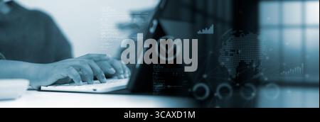 Smart business technology. Professional hands typing on keyboard in blue digital office with futuristic transparent interface showing charts, data ana Stock Photo