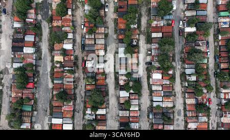 Aerial View of Old Metal Garages in Urban Area - Rusty Rooftops and Grid Layout Stock Photo