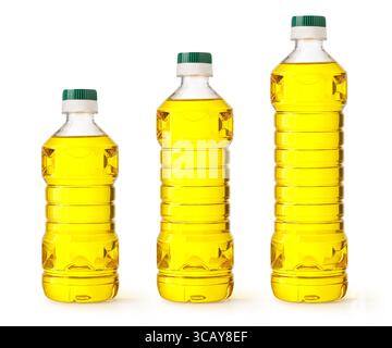Three different sizes of clear plastic bottles containing golden yellow vegetable oil stand on a white background Stock Photo